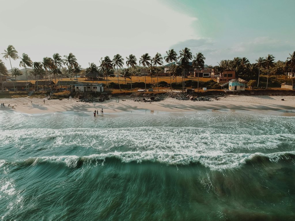 pexels-photo-2787815-2787815 Stunning aerial view of a tropical beach with palm trees in Accra, Ghana, during sunset.